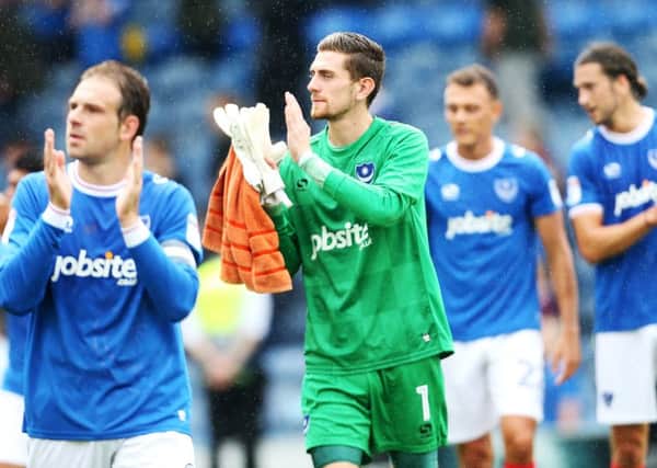 Luke McGee applauds the Fratton faithful after his Pompey debut against Rochdale. Picture: Joe Pepler