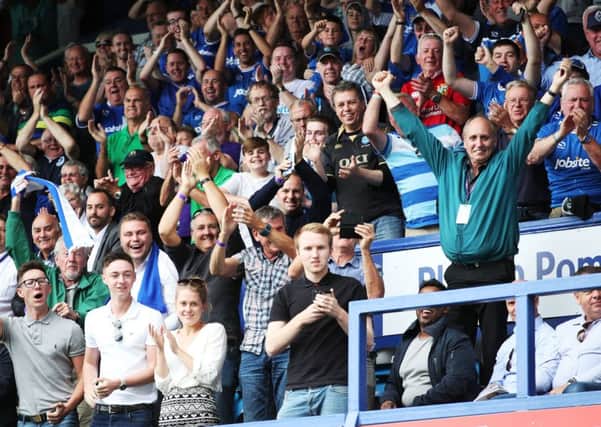 Pompey fans celebrate against Rochdale. Picture: Joe Pepler