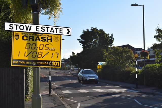 Police sign for help at the scene of last night's accident