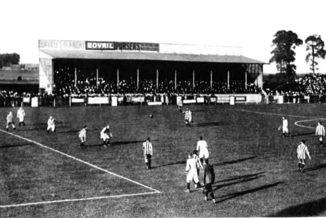 In front of a packed North Stand at Fratton Park, perhaps before the First World War, Pompey take on what is believed to be West Bromwich Albion. For those of you watching in black and white, Pompey are in the salmon shirts...