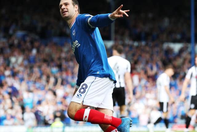 Brett Pitman scored twice as Pompey returned to League One with a 2-0 victory against Rochdale last weekend