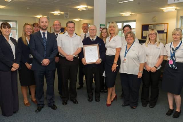 Chris Hayward is presented with a certificate by Captain Andy Jordan at HMS Collingwood after 42 years' service with the navy Picture: Keith Woodland