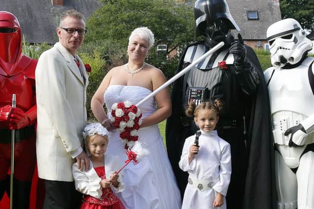 Lee Bowder and Pip Stephenson at their wedding with some of their Star Wars themed guests SNL-150828-123422012
