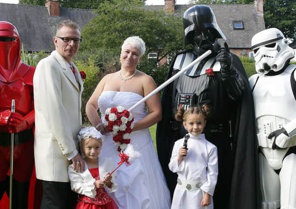 Lee Bowder and Pip Stephenson at their wedding with some of their Star Wars themed guests SNL-150828-123422012