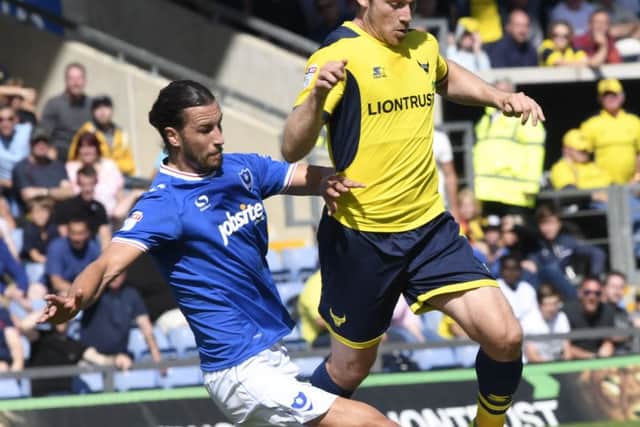 Pompey's Christian Burgess goes in for a tackle against Oxford. Picture: Joe Pepler/Digital South