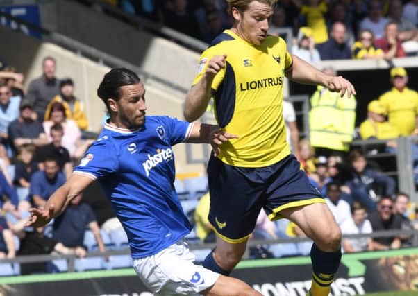Pompey's Christian Burgess goes in for a tackle against Oxford. Picture: Joe Pepler/Digital South