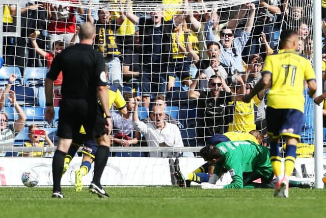Wes Thomas gave Oxford the lead after a fumble by Pompey keeper Luke McGee Picture; Joe Pepler