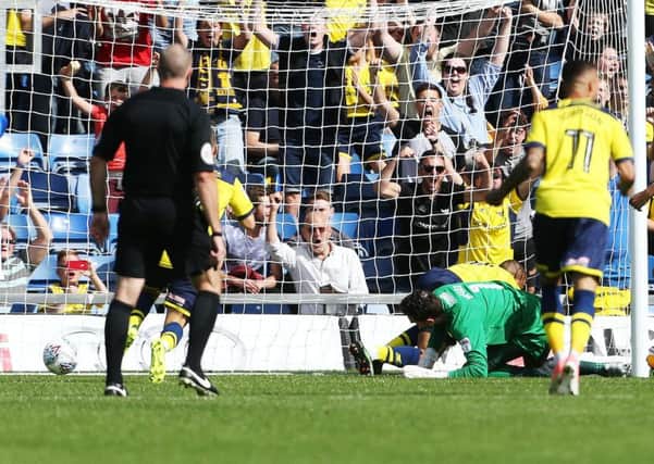 Wes Thomas gave Oxford the lead after a fumble by Pompey keeper Luke McGee Picture; Joe Pepler