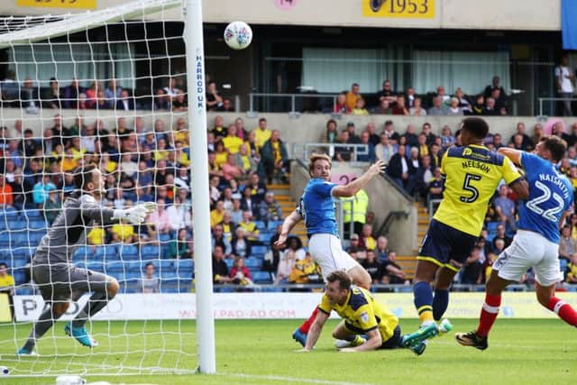 Brett Pitman heads home, only for the goal to be disallowed. Picture: Joe Pepler