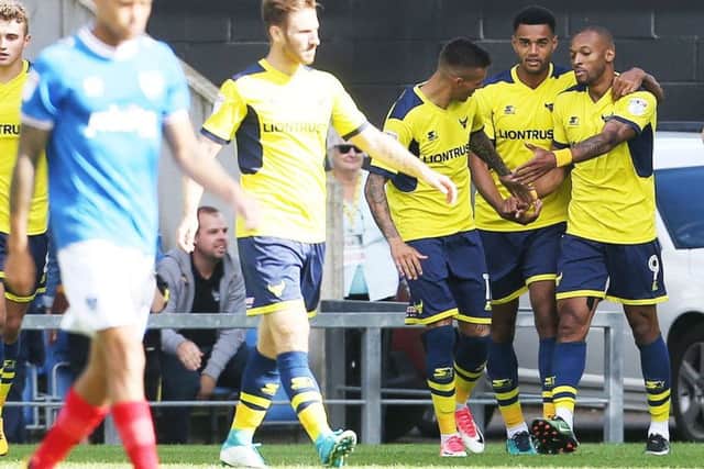 Wes Thomas celebrates his opening goal. Picture: Joe Pepler