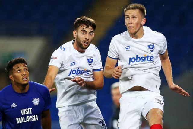 Pompey midfielder Ben Close, centre, with Adam May Picture: Joe Pepler