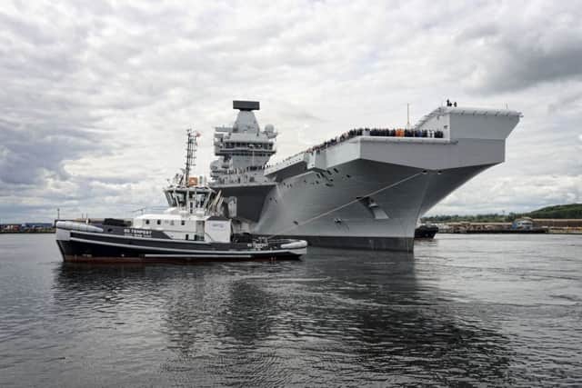 The Royal Navy's new aircraft carrier HMS Queen Elizabeth exits from Rosyth Dockyard for sea trials on 26 June 2017. PPP-170708-155402001