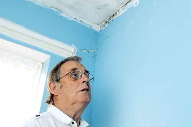 Stan Auld with some of the damp and mould damage