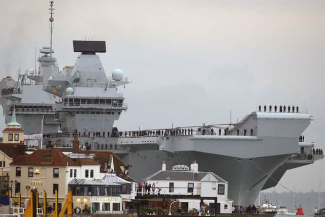 HMS Queen Elizabeth, the UK's newest aircraft carrier, arrives in Portsmouth for the first time. PRESS ASSOCIATION Photo. Picture date: Wednesday August 16, 2017. The 65,000-tonne carrier, the largest warship ever to be built in Britain, is expected to be the Navy's flagship for at least 50 years. See PA story DEFENCE Carrier. Photo credit should read: Steve Parsons/PA Wire DEFENCE_Carrier_074512.JPG