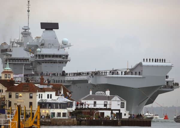 HMS Queen Elizabeth, the UK's newest aircraft carrier, arrives in Portsmouth for the first time. PRESS ASSOCIATION Photo. Picture date: Wednesday August 16, 2017. The 65,000-tonne carrier, the largest warship ever to be built in Britain, is expected to be the Navy's flagship for at least 50 years. See PA story DEFENCE Carrier. Photo credit should read: Steve Parsons/PA Wire DEFENCE_Carrier_074512.JPG
