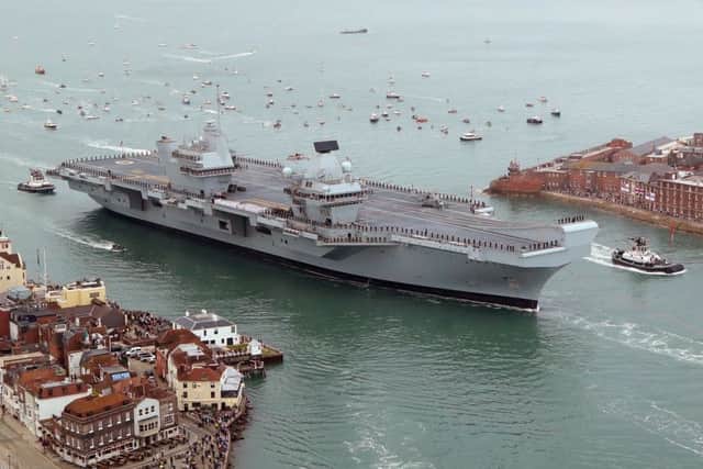 HMS Queen Elizabeth passes the Point in Old Portsmouth Picture: Gareth Fuller / PA Wire