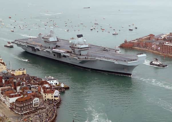 HMS Queen Elizabeth passes the Point in Old Portsmouth Picture: Gareth Fuller / PA Wire