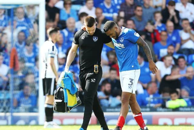 Tareiq Holmes-Dennis limps off injured against Rochdale. Picture: Joe Pepler