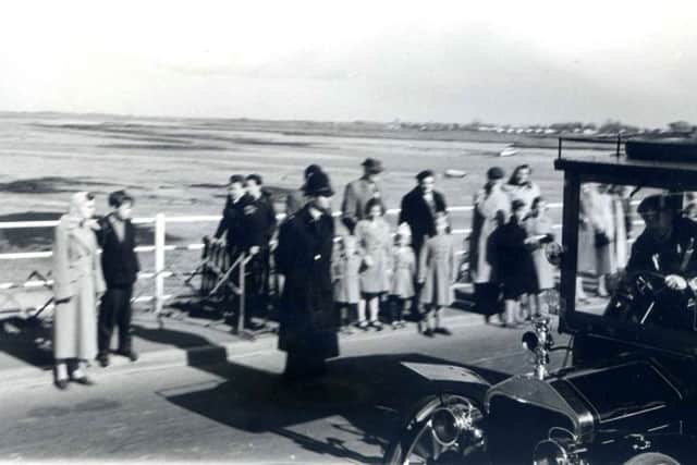 A vintage car crosses Hayling bridge on toll-free day...