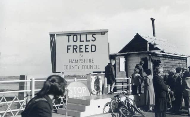 April 11, 1960, and the Stop and Pay sign is put away on Hayling bridge.