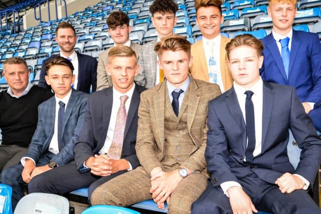 Pompey unveiled their latest crop of first-year apprentices, including Joe Hancott, front row second right, at the end of June