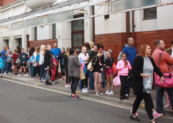 Youngsters queue at the Kings to audition for a previous production, Cinderella