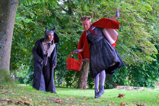 Grimm's Fairy Tales for Young and Old. Hal Darling as The Wolf, Emily Wells as Little Red Riding Hood. Photo by Paul Inskip