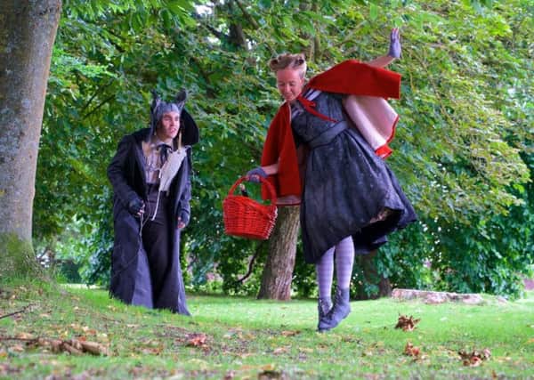 Grimm's Fairy Tales for Young and Old. Hal Darling as The Wolf, Emily Wells as Little Red Riding Hood. Photo by Paul Inskip