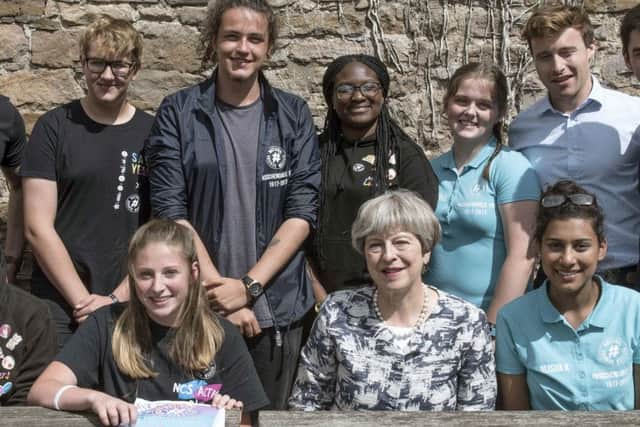 Prime minister Theresa May with Marley Callway from Portsmouth (far left, back row)