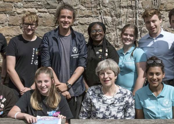 Prime minister Theresa May with Marley Callway from Portsmouth (far left, back row)