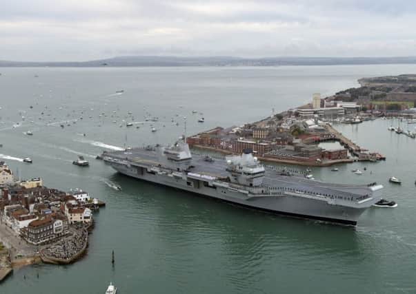 Arrival of new aircraft carrier 
HMS Queen Elizabeth at Portsmouth Naval 
Base.

Picture: Neil Marshall