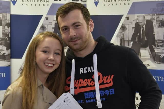 Fellow student Bethany Toon, 17, with Bruce Wetherill, 25, at St Vincent College, Gosport  Picture: Neil Marshall (171028-16)