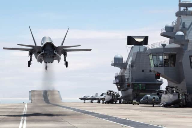 A computer-generated image of an F-35B Lightning II jet landing vertically on HMS Queen Elizabeth Picture: BAE Systems/PA Wire