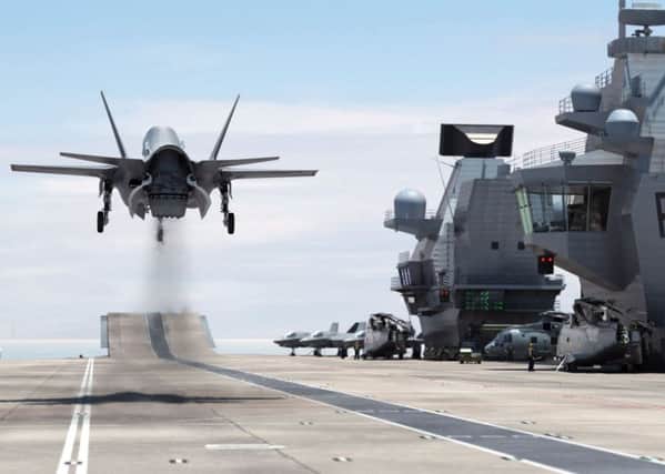 A computer-generated image of an F-35B Lightning II jet landing vertically on HMS Queen Elizabeth Picture: BAE Systems/PA Wire