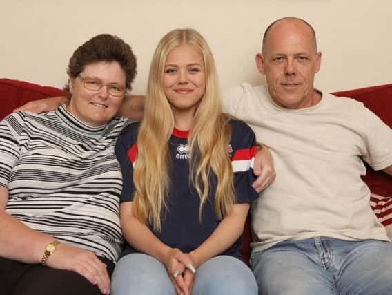 Transplant Games swimmer Nicole Mackenzie with her mum Julie and dad, David, who gave her one of his kidneys