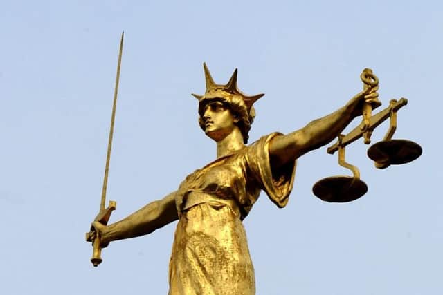 Scales of Justice. Picture: PA