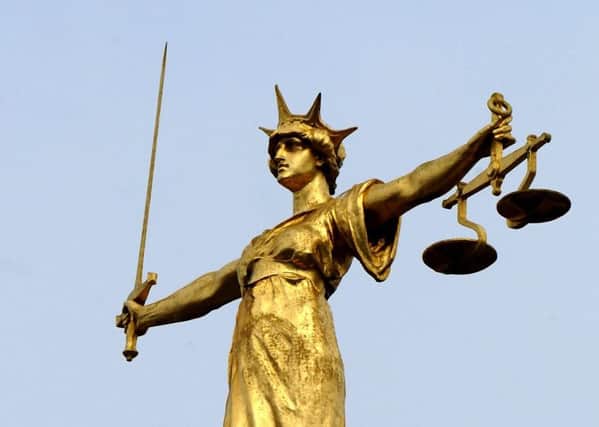 Scales of Justice. Picture: PA