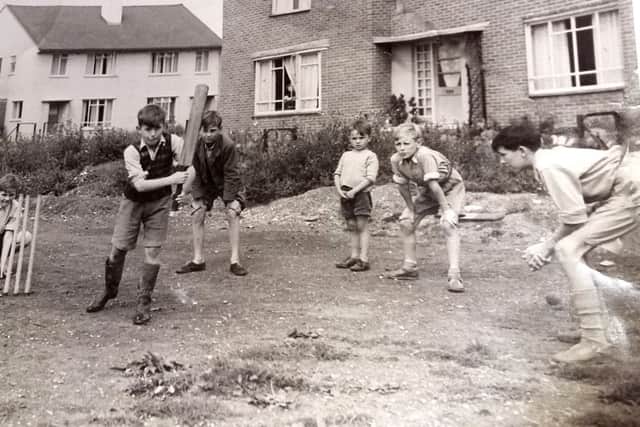 THEN: With Michael Faithful guarding the wicket and fielders close in, here are lads enjoying cricket on the early Leigh Park estate.