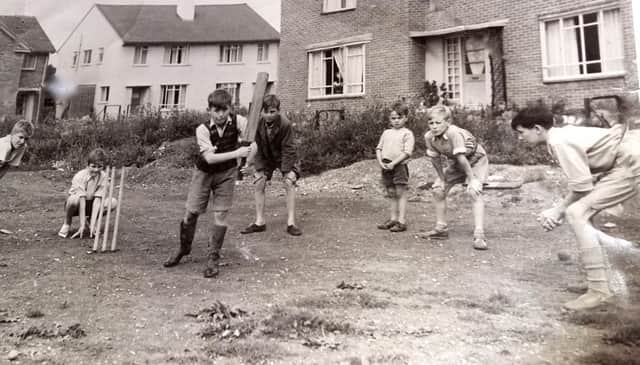 THEN: With Michael Faithful guarding the wicket and fielders close in, here are lads enjoying cricket on the early Leigh Park estate.