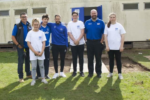 (L-r) Rob Williams (Wickes Waterlooville store manager),  Chervonne Rosher (volunteer), Tommy Spencer (volunteer), Pompey player  Milan Lalkovic, Ty Symmes (volunteer), Tim Wordly (Wickes Havant store manager) and Connie Glavin (volunteer)
