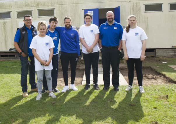 (L-r) Rob Williams (Wickes Waterlooville store manager), Chervonne Rosher (volunteer), Tommy Spencer (volunteer), Pompey player Milan Lalkovic, Ty Symmes (volunteer), Tim Wordly (Wickes Havant store manager) and Connie Glavin (volunteer)