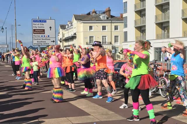 Colourful dancers from Fit n Funky perform outside South Parade Pier, where supporters gathered for the start of the Pride parade