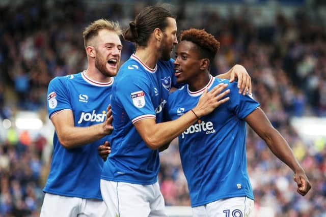Jamal Lowe celebrates with Christian Burgess and Matt Clarke. Picture: Joe Pepler