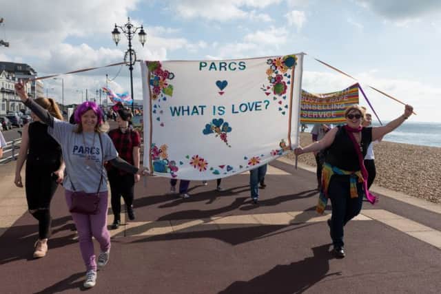 Happy marchers wave their banners as they set off from South Parade Pier  Picture: Duncan Shepherd (171248-017)