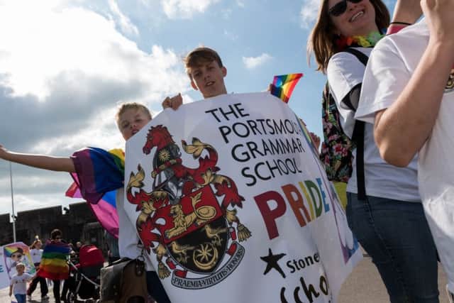 Revellers wave the Portsmouth Grammar School banner at the Portsmouth Pride parade  Picture: Duncan Shepherd (171248-025)