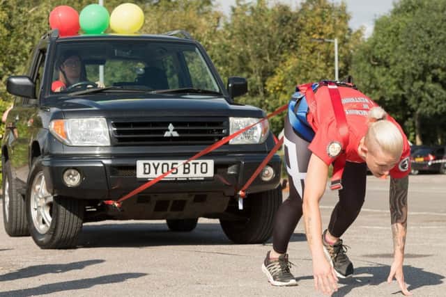 Vicky Clisset pulling her Mitsubishi Shogun car in memory of her dear friend Laura Westbrook  Picture Credit: Keith Woodland (171020-0061)