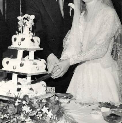 Terry and Helen cutting the cake back in 1957