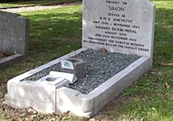 SHIP'S CAT SIMON AND HIS GRAVE

Able Seacat Simon on board HMS Amethyst and his grave at Ilford, east London.