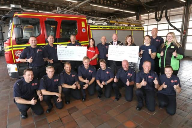 Jasper Taylor pictured with the firefighters, Mayor Ken Ellcome and his wife Jo, Kerry James from the Firefighter's Charity. Picture: Habibur Rahman