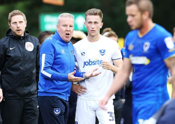 Kenny Jackett talks tactics with Adam May during a break in play at Wimbledon